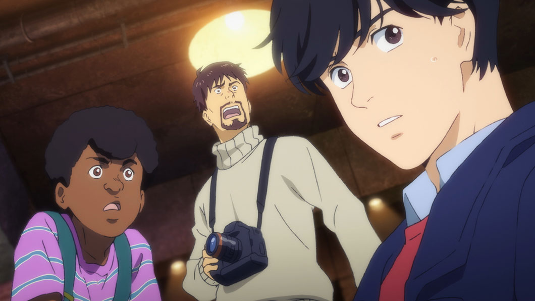 Eiji Okumura in the foreground, with Shunichi Ibe carrying a camera behind him; official episode 1 promotional still